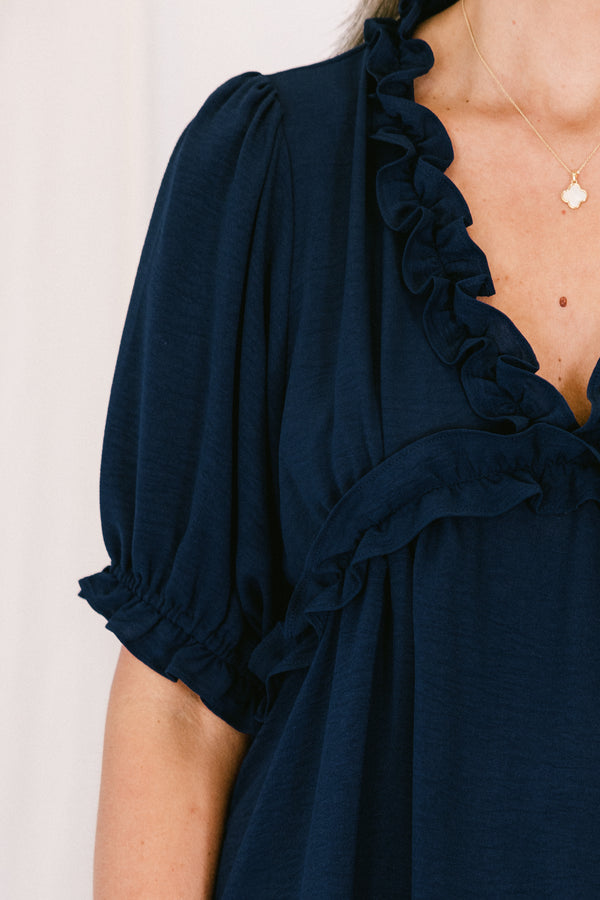Chic soul plus size clothing, navy top with a v-neck and ruffles at the end of the sleeves and along the neckline 