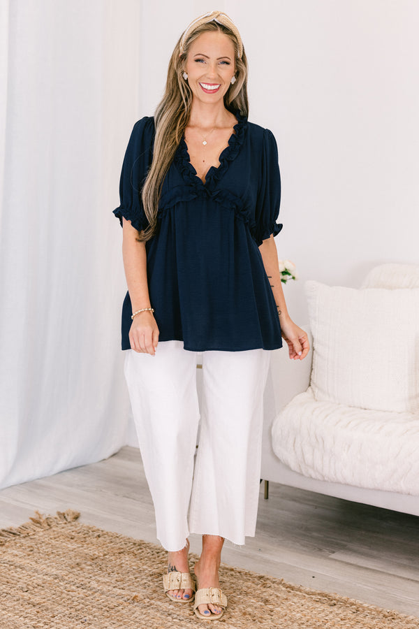 Chic soul plus size clothing, navy top with a v-neck and ruffles at the end of the sleeves and along the neckline 