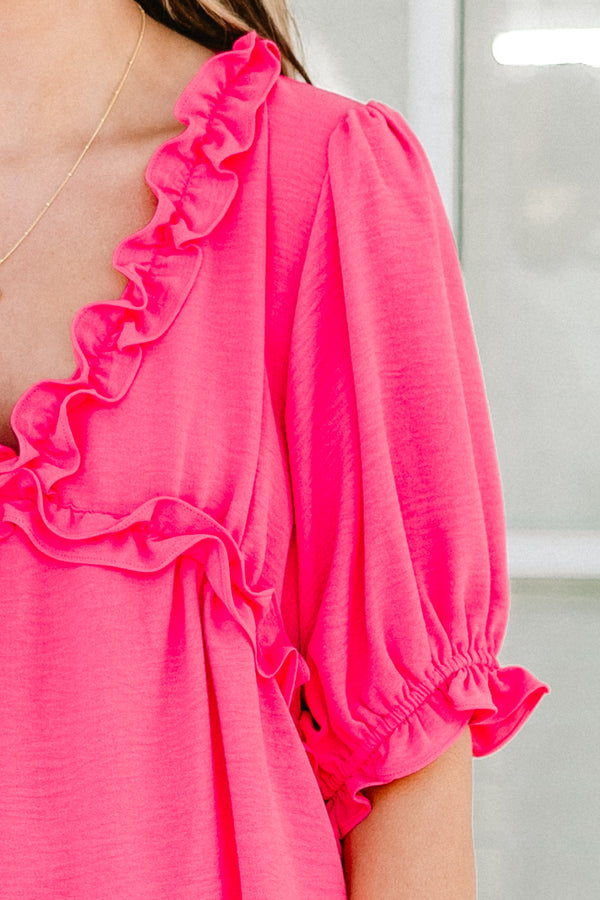 Chic soul plus size clothing, pink short sleeve top with ruffle details on the bottom of the sleeves as well as the v-neckline 
