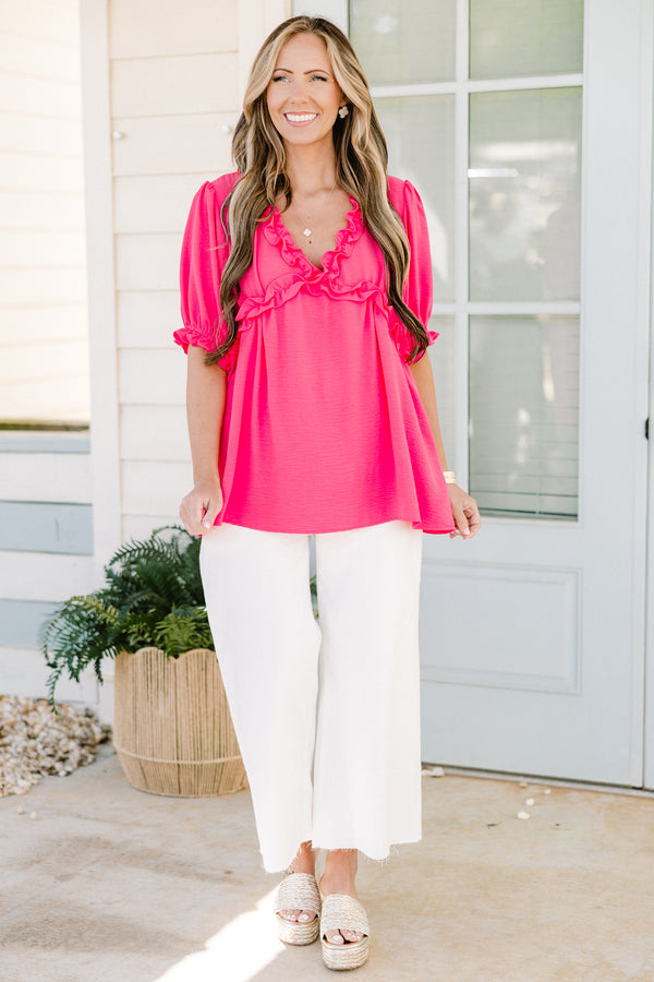 Chic soul plus size clothing, pink short sleeve top with ruffle details on the bottom of the sleeves as well as the v-neckline 

