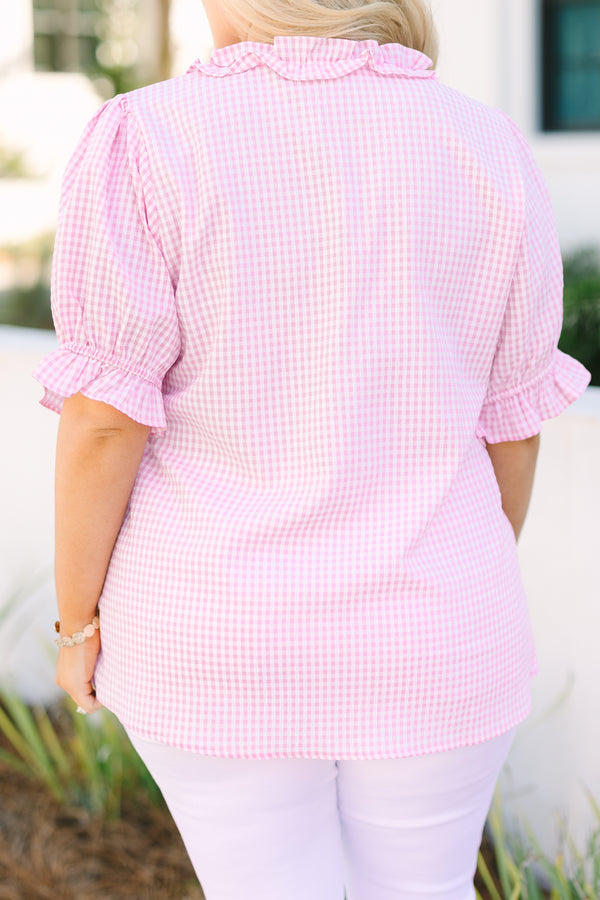 Chic Soul plus size clothing, pink gingham top with short bubble sleeves that have a ruffle detail at the end of each sleeve as well as ruffle detailing along the bottom of the chest and v-neckline 
