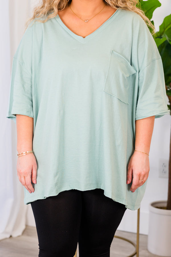 Chic Soul plus size clothing, light green top with short sleeves, v-neckline, and left chest pocket