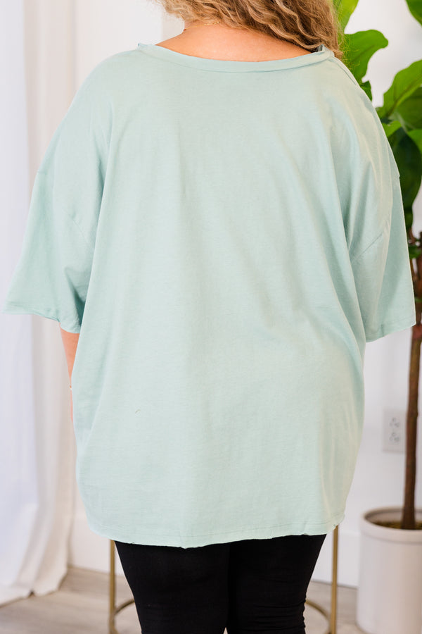 Chic Soul plus size clothing, light green top with short sleeves, v-neckline, and left chest pocket