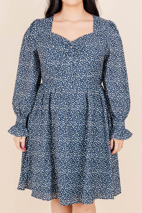 Chic Soul Plus size clothing, navy knee length dress with long sleeves, v-neck and blue and white floral print.