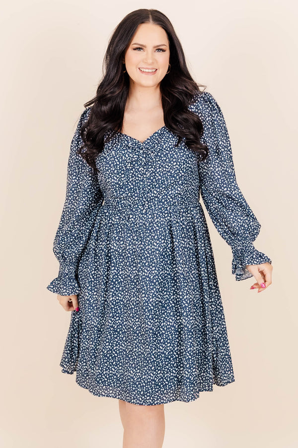 Chic Soul Plus size clothing, navy knee length dress with long sleeves, v-neck and blue and white floral print.