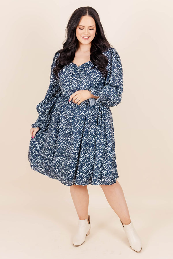 Chic Soul Plus size clothing, navy knee length dress with long sleeves, v-neck and blue and white floral print.