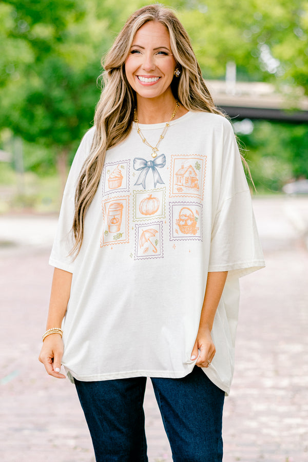 Chic Soul plus size clothing, ivory graphic tee with all post stamp graphics on the center of the shirt and a blue bow above them
