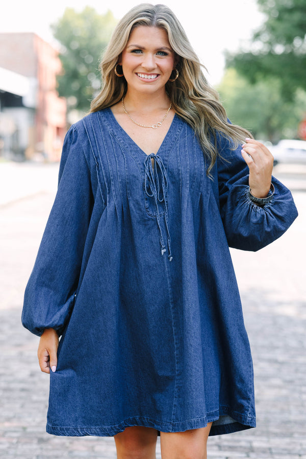 Chic Soul plus size clothing, blue denim long sleeve dress with a v-neckline and a bow detail on the center of the neckline 