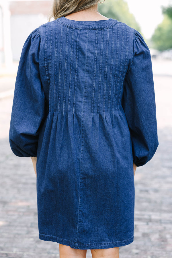 Chic Soul plus size clothing, blue denim long sleeve dress with a v-neckline and a bow detail on the center of the neckline 