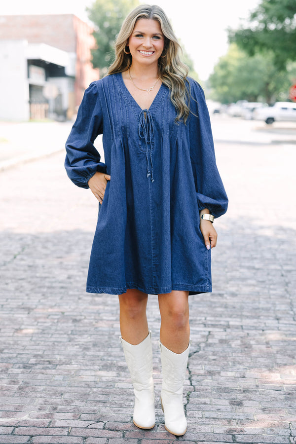 Chic Soul plus size clothing, blue denim long sleeve dress with a v-neckline and a bow detail on the center of the neckline 