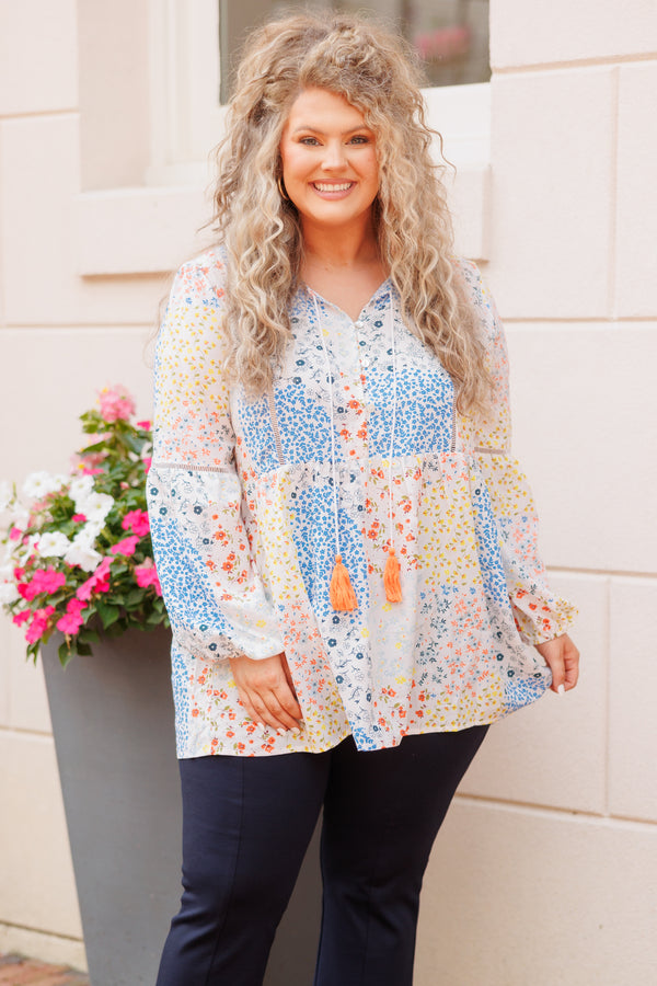Chic Soul plus size clothing, ivory babydoll top with multicolor color block floral pattern and tassel strings