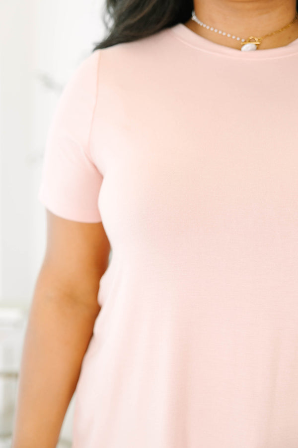 Plus size  dusty rose tunic top with a flowy fit and curved hem