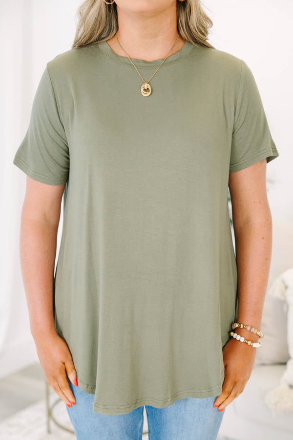 Plus size olive green top with a flowy fit and short sleeves.