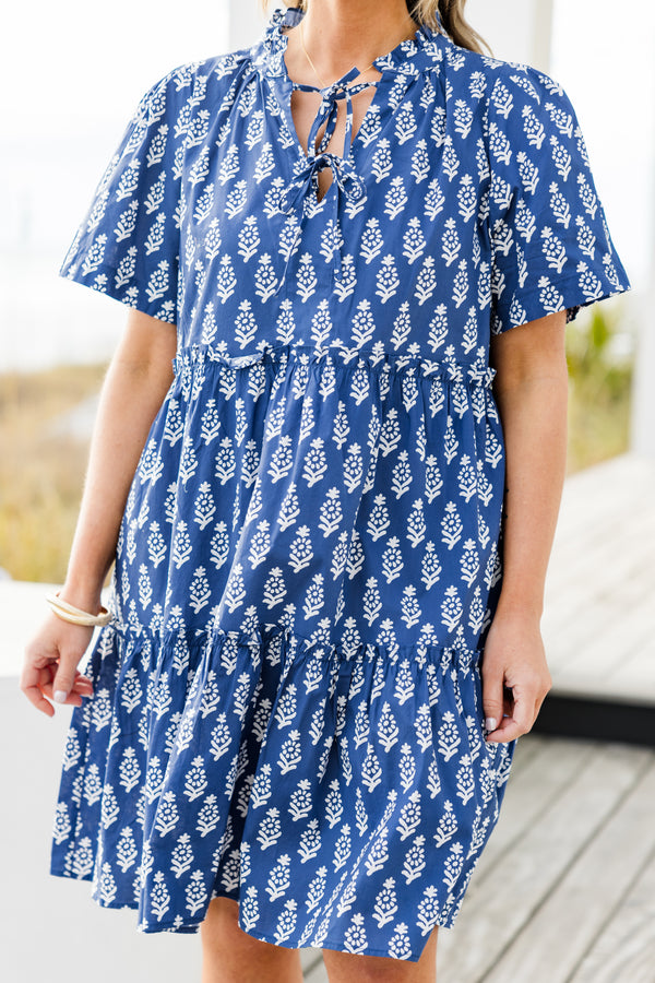 Chic Soul plus size clothing, navy short sleeve mini tiered dress with v cutout along neckline with tie detail with ruffle neckline with white eyelet design with ruffles along tiers