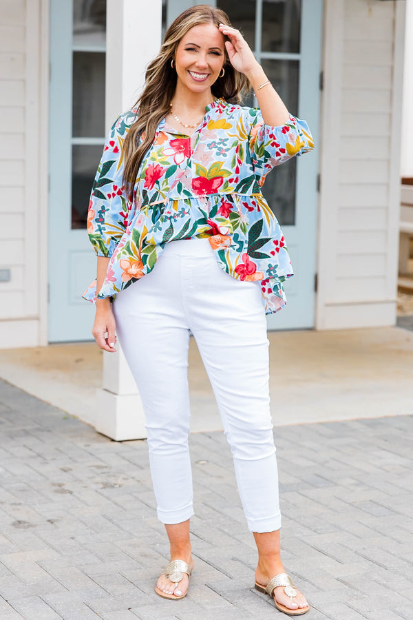 Plus Size blue floral print flowy top with three-quarter sleeves and a tie neckline.