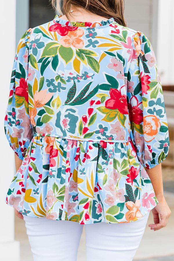 Plus Size blue floral print flowy top with three-quarter sleeves and a tie neckline.
