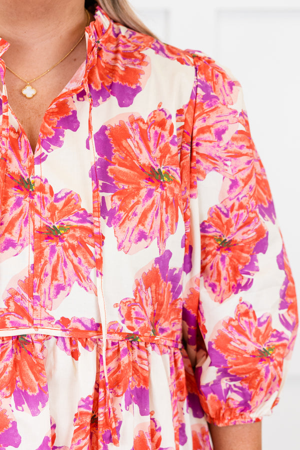 Chic Soul plus size clothing, short-puffed-sleeve pink baby doll top with a split-v-neckline and tassels with a purple and pink floral pattern 