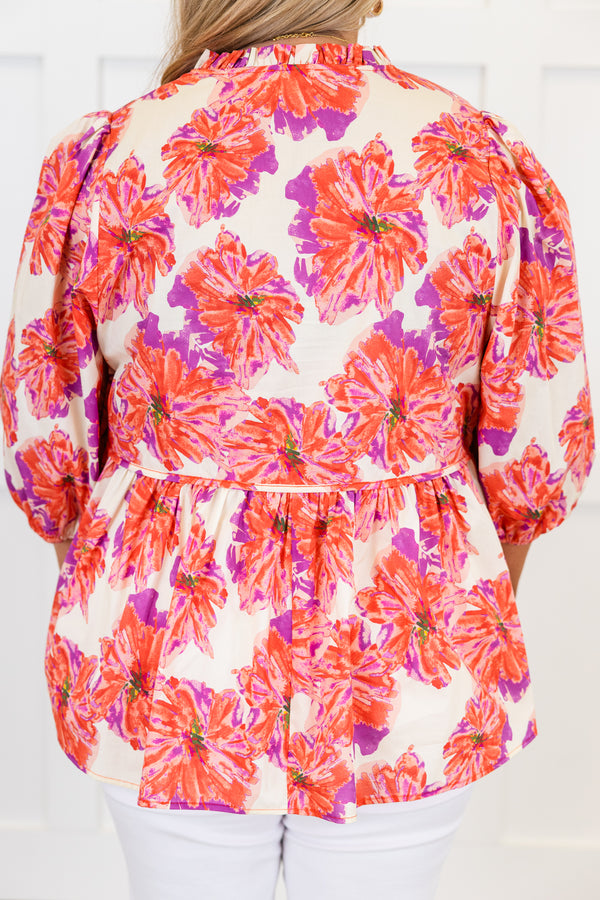 Chic Soul plus size clothing, short-puffed-sleeve pink baby doll top with a split-v-neckline and tassels with a purple and pink floral pattern 