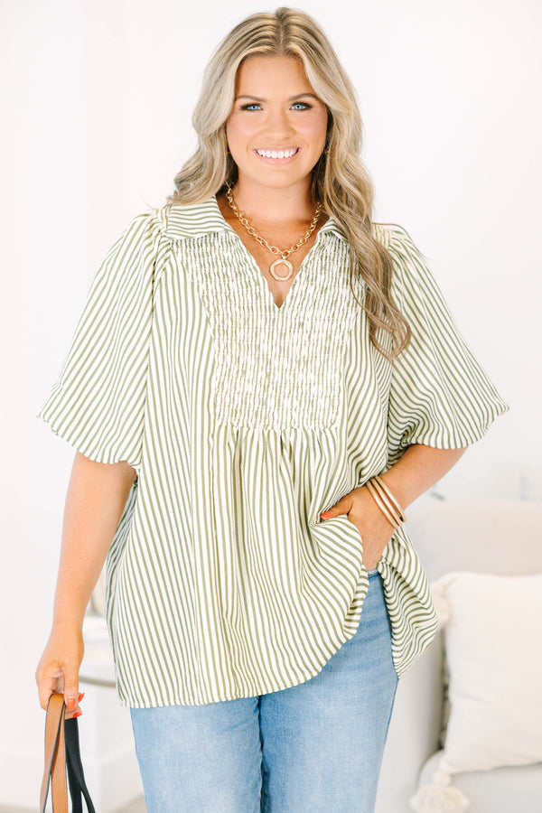 Plus Size olive and white striped top with smocked chest, v-neckline, and short flutter sleeves.