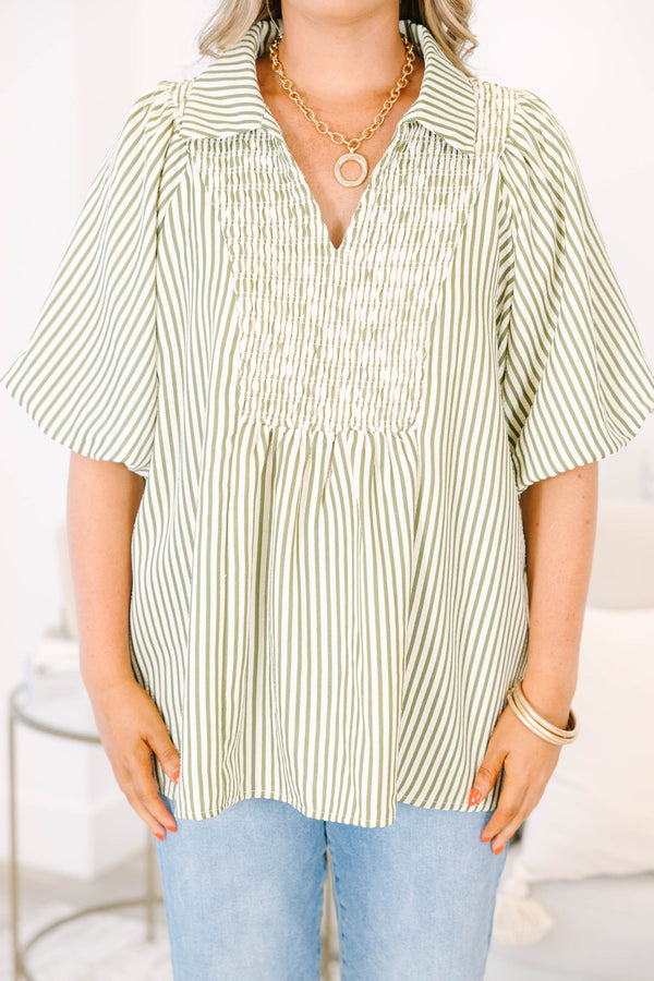 Plus Size olive and white striped top with smocked chest, v-neckline, and short flutter sleeves.