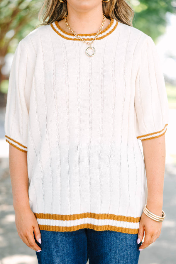 Plus size woman in oatmeal ribbed knit top with mustard stripes