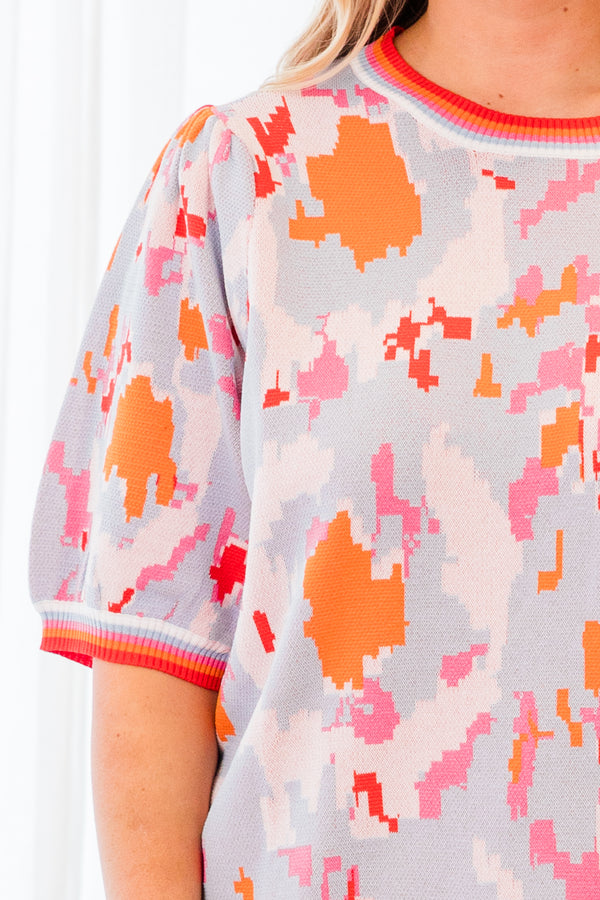 Chic Soul plus size clothing, short-sleeve puffed sleeve knit powder blue top with orange and pink camo pattern and lined pattern on sleeves and neckline 