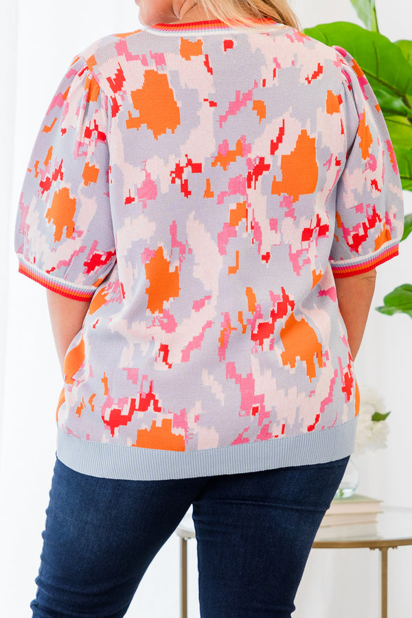 Chic Soul plus size clothing, short-sleeve puffed sleeve knit powder blue top with orange and pink camo pattern and lined pattern on sleeves and neckline 