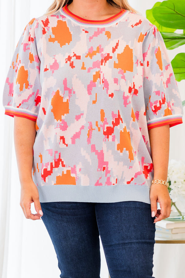 Chic Soul plus size clothing, short-sleeve puffed sleeve knit powder blue top with orange and pink camo pattern and lined pattern on sleeves and neckline 