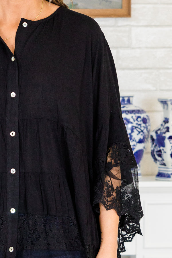 Plus Size black button-down blouse with tiered lace trim and wide lace-cuffed sleeves.