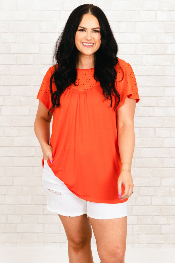 Chic Soul plus size clothing, orange flowy top with eyelet lace pattern across the top