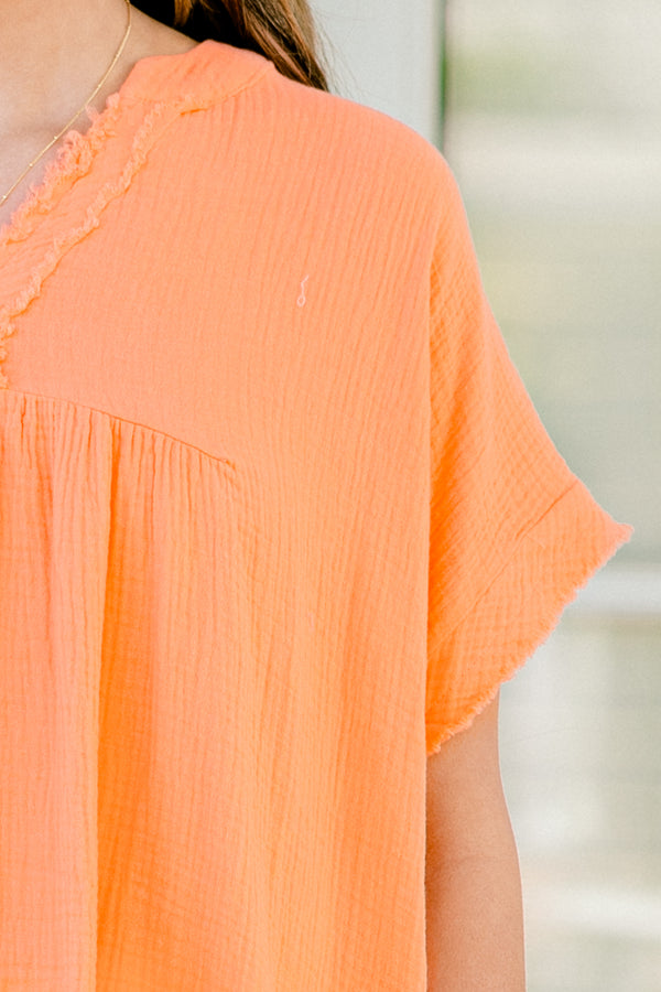 Chic Soul plus size clothing, short-sleeve distressed coral orange top with a v-neckline and a high-low distressed hemline 
