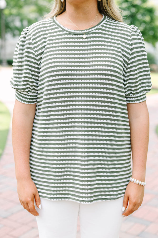 Plus size olive green top with white stitched stripes, puff sleeves, and a relaxed, flowy fit.