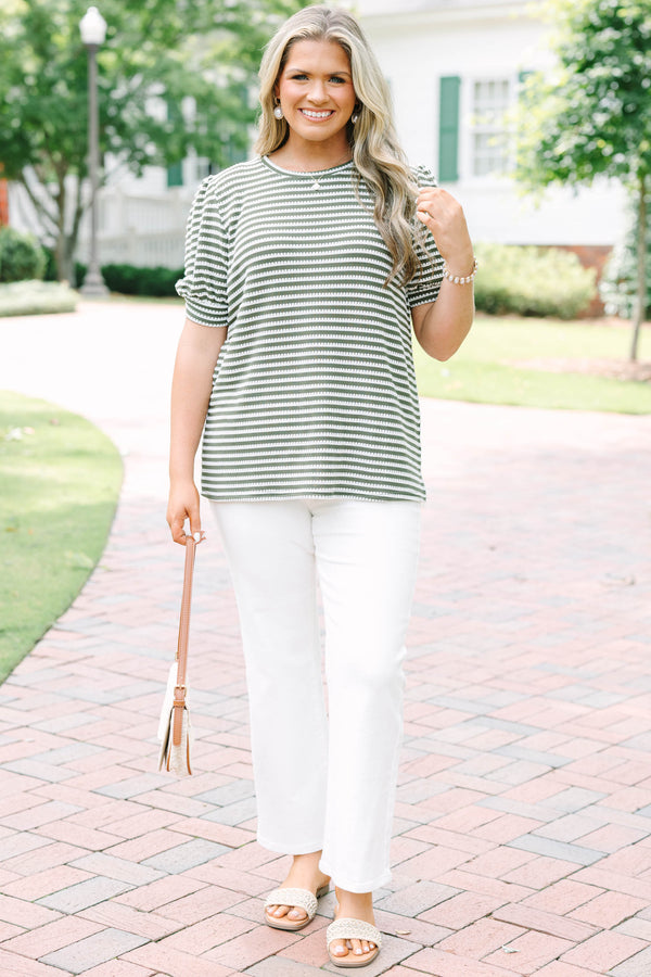 Plus size olive green top with white stitched stripes, puff sleeves, and a relaxed, flowy fit.
