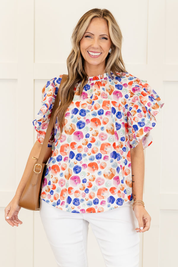 Chic Soul plus size clothing, white short sleeve top with multi dot design with flare ruffle sleeves with ruffle detail along neckline