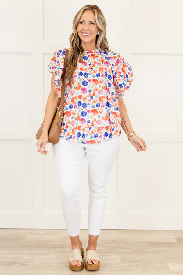Chic Soul plus size clothing, white short sleeve top with multi dot design with flare ruffle sleeves with ruffle detail along neckline