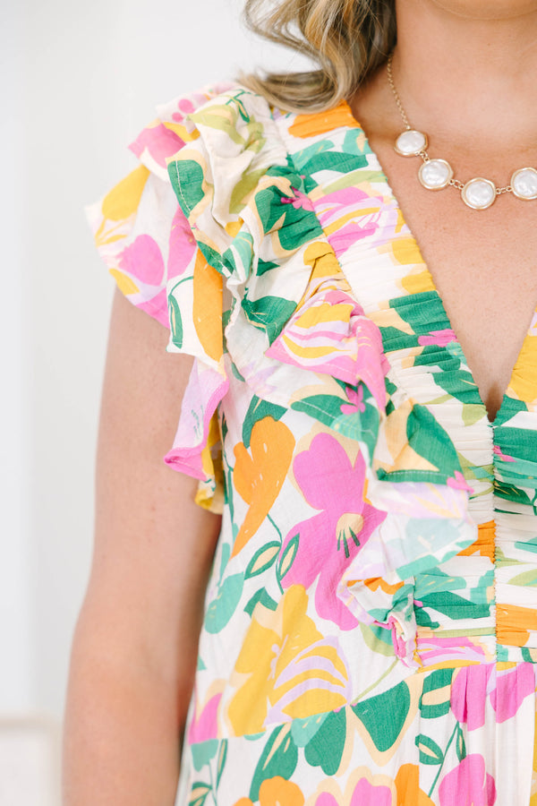 Plus size Dream Vacation Dress in a multi-color floral print with ruffle sleeves and a flowy fit.