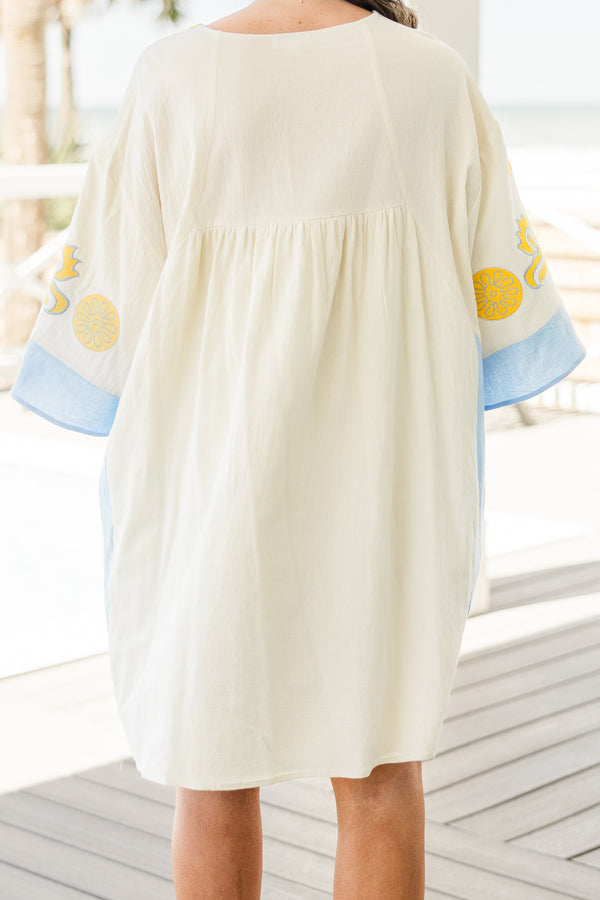 Chic Soul plus size clothing, white short sleeve mini sundress with v neckline with blue detail along bottom of sleeves with blue along the sides with yellow/blue embroidery along chest