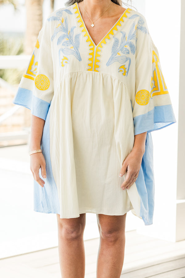Chic Soul plus size clothing, white short sleeve mini sundress with v neckline with blue detail along bottom of sleeves with blue along the sides with yellow/blue embroidery along chest