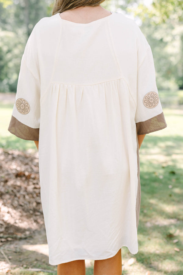 Plus Size cream and brown cotton dress with embroidered V-neckline and loose, wide sleeves.