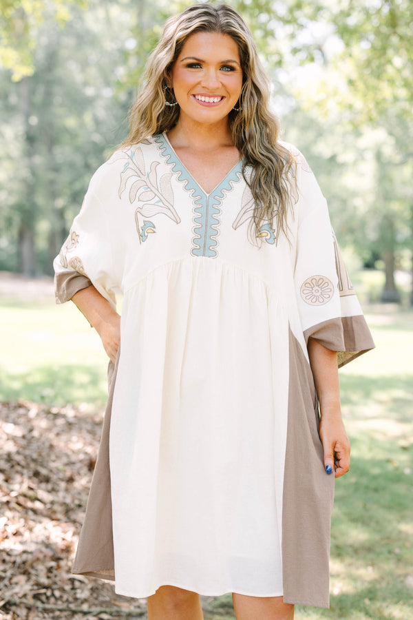 Plus Size cream and brown cotton dress with embroidered V-neckline and loose, wide sleeves.
