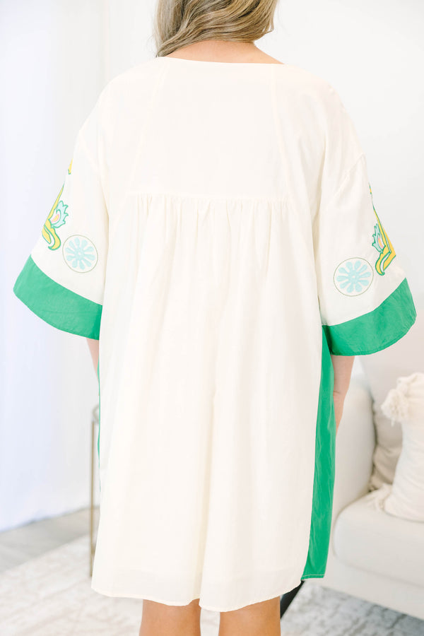 Plus size Dress in green and taupe with boho embroidery and a flowy babydoll fit.
