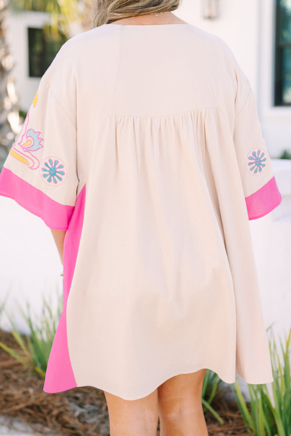Chic Soul plus size clothing, white short sleeve mini sundress with v neckline with pink detail along bottom of sleeves with pink along the sides with yellow/blue embroidery along chest