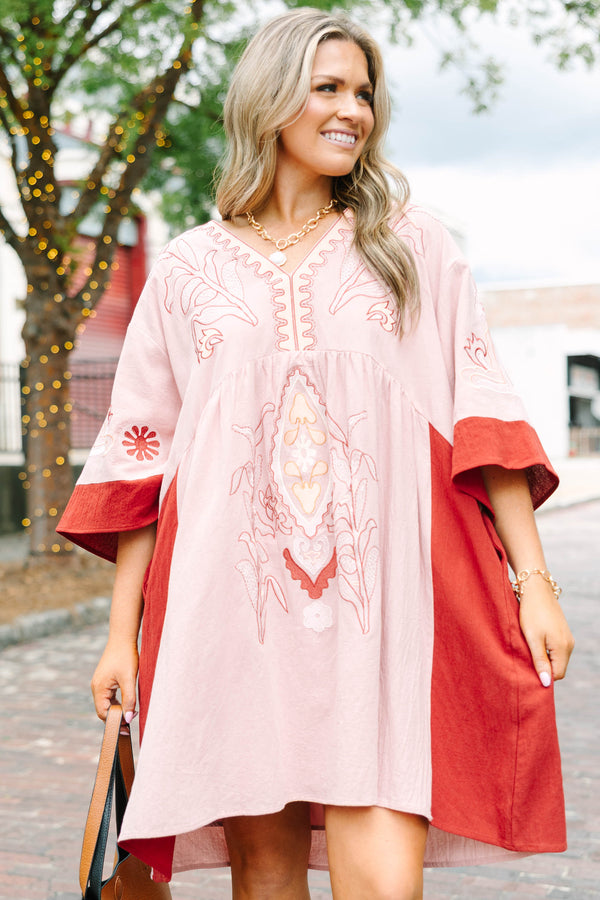 Plus Size pink blush and rust colorblock babydoll dress with intricate embroidery and wide sleeves.