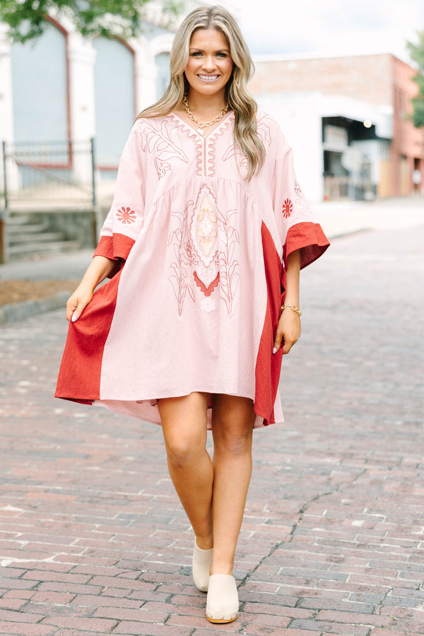 Plus Size pink blush and rust colorblock babydoll dress with intricate embroidery and wide sleeves.