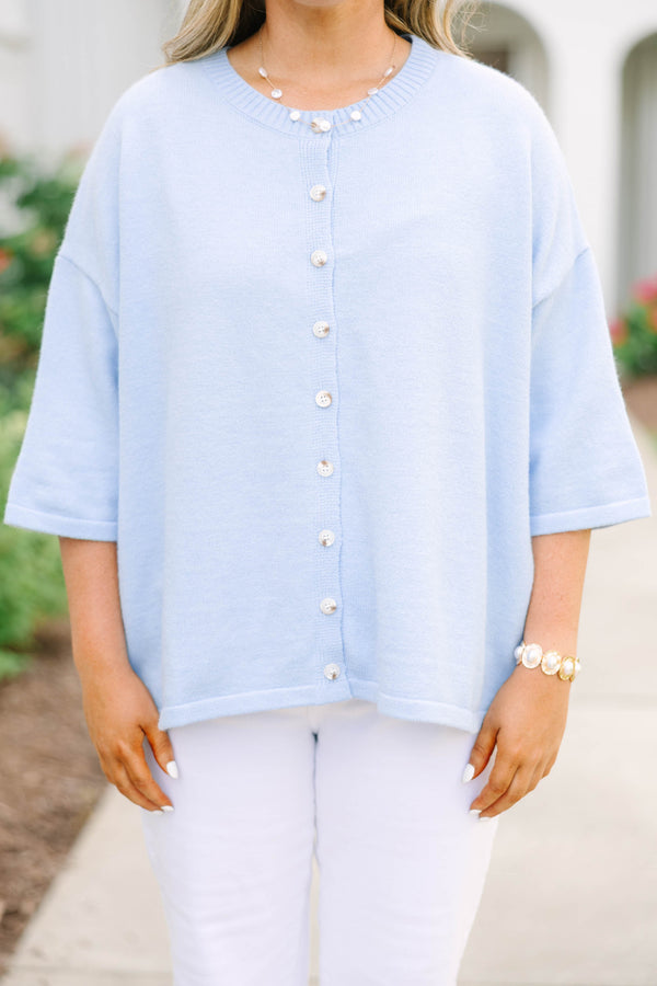 Plus Size light blue oversized cardigan with short sleeves and pearl button-down front.