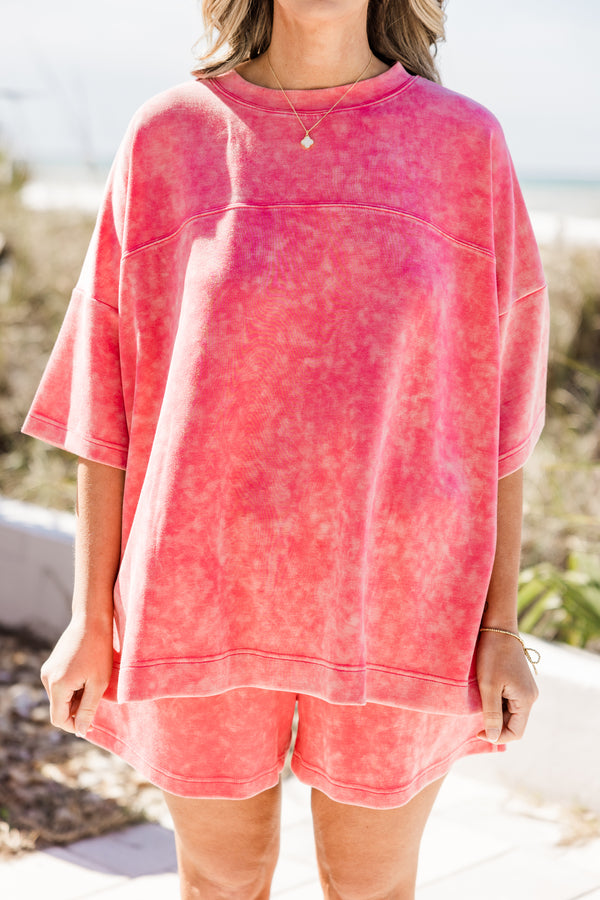 Plus Size pink acid wash short sleeve top with a crew neck and drop shoulder.