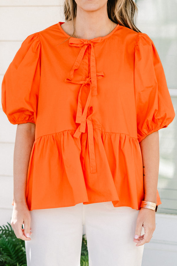 Chic Soul plus size clothing, orange short puff sleeve babydoll top with three bow ties down the front
