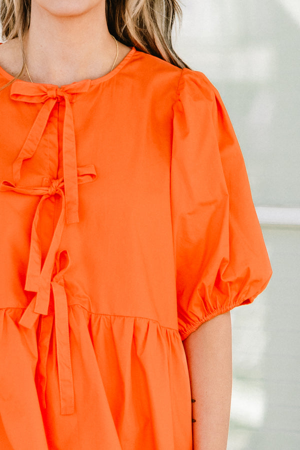Chic Soul plus size clothing, orange short puff sleeve babydoll top with three bow ties down the front