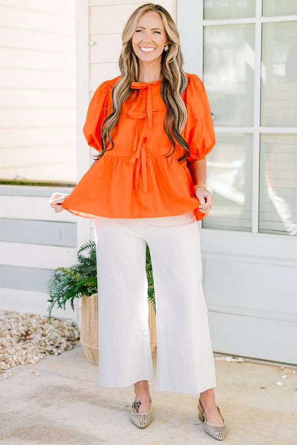 Chic Soul plus size clothing, orange short puff sleeve babydoll top with three bow ties down the front