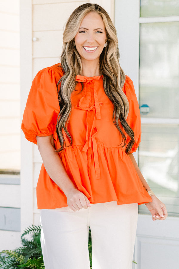 Chic Soul plus size clothing, orange short puff sleeve babydoll top with three bow ties down the front